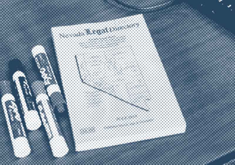 Stylized accent image of a Nevada Legal Directory sitting on a table