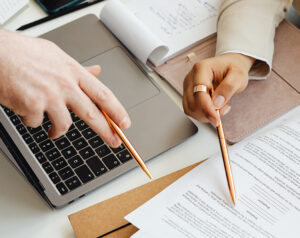 two people looking over paperwork