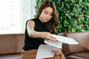 woman looking at paperwork